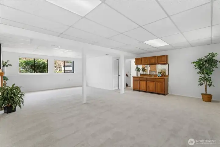 Downstairs offers a generous family room with a wet bar.