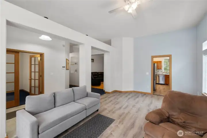 Open living room flowing toward the kitchen and surrounding rooms for easy everyday living.