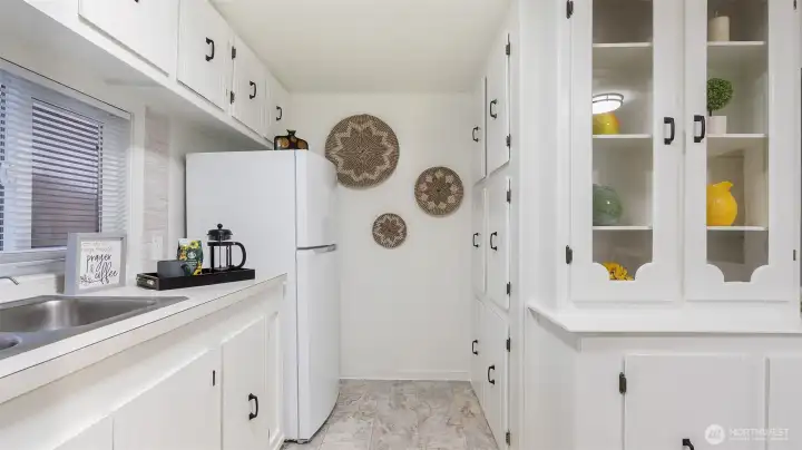 Notice the pantry cabinets across from the refrigerator. There's a ton of storage space in this kitchen.