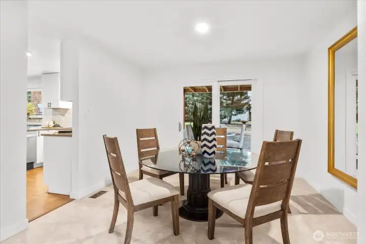Formal dining room opens to covered deck - great for everyday living or entertaining.