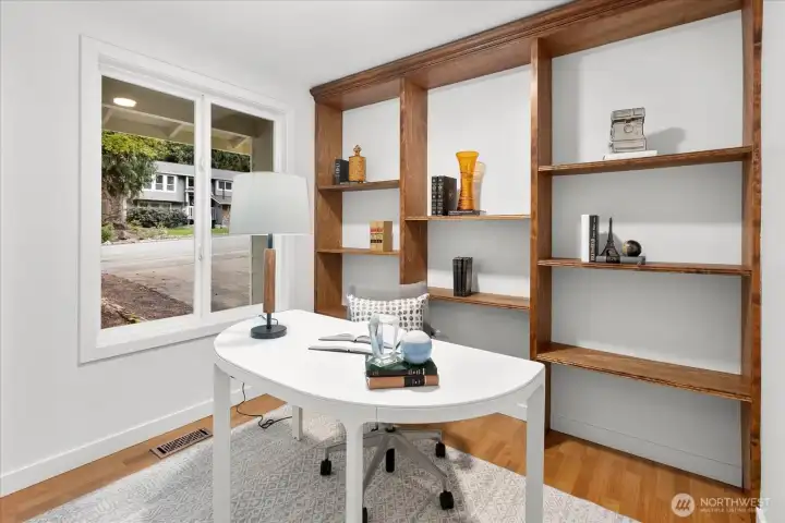 Downstairs office/flex room w/ built-in shelves.