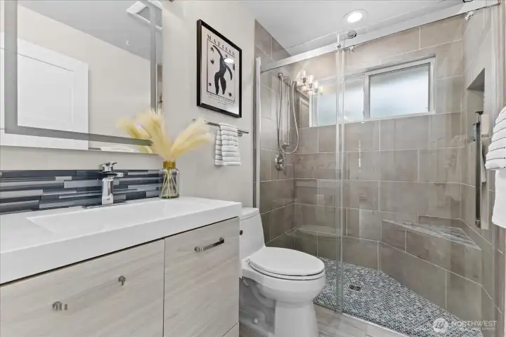 Guest bathroom with walk in shower. Both 3/4 bathrooms have been updated.