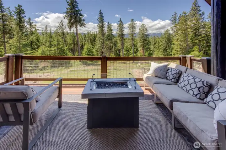 covered porch off living room with gas fire