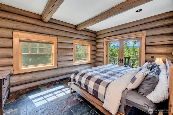 Primary bedroom on main floor with ensuite bath and 2 walk-in closets