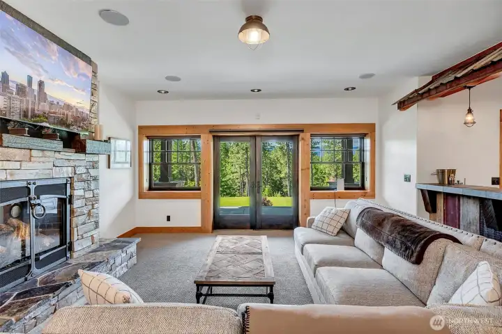 Lower level with gas fireplace, walks out to hot tub and sauna area. This is the party zone!