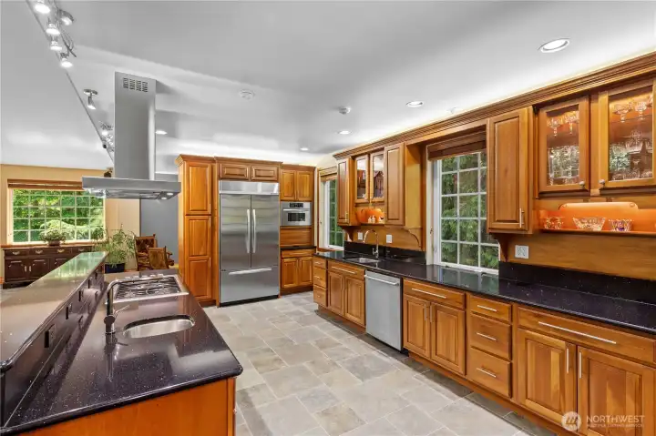 Chef's kitchen with high end stainless appliances and double sinks. Chef's kitchen with high end stainless appliances and double sinks.