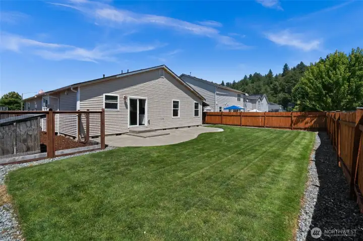 Fully fenced backyard with dog run.