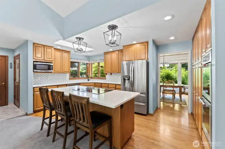 Updated kitchen with large island and quarts counters.