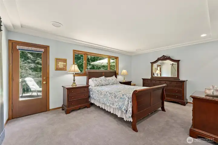 Primary bedroom with private access to large deck.