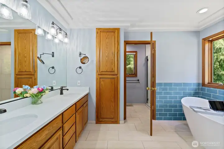 Private 5-piece primary bathroom with quartz counters and heated tile floors.