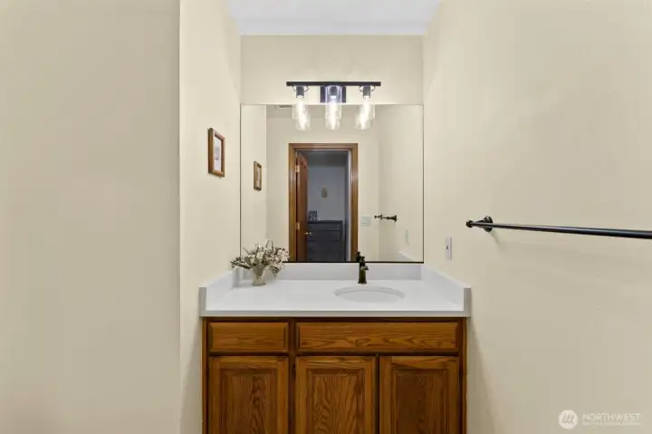 Half bath off of great room with updated Quarts counters.