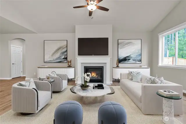 Great room fireplace includes ready to mount smurf tubing for your big screen tv! Photo is virtually staged for reference only.