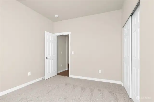 Spacious 3rd bedroom. Photo from same plan on different lot, finishes and features will vary.