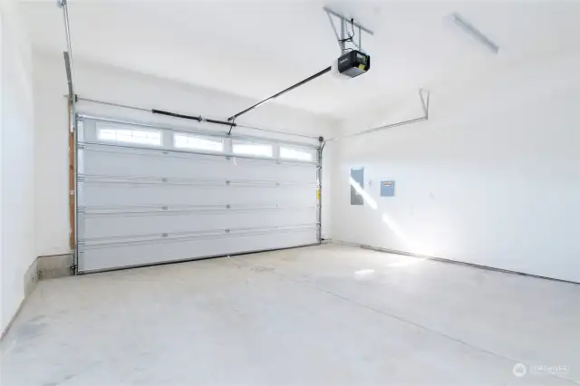 The garage includes an opener w/2 remote controls for easy access while the accent windows allow natural light.