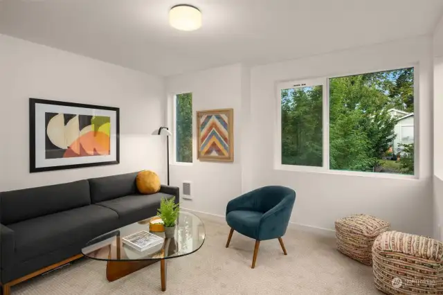 Second floor bedroom is spacious with lots of windows (we've staged it as a sitting room...)