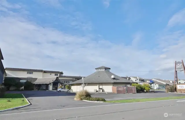 The Polynesian Hotel Condo ~ Front, parking lot, and The Rusty Anchor Restaurant.