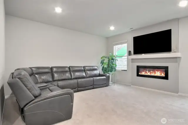 Living room with a warm fireplace