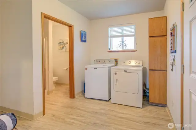 Side entry utility area with 3/4 bathroom.