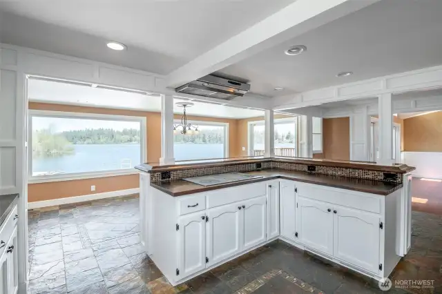 Plenty of work space with this corner shaped island with island seating and breath taking views of the lake.