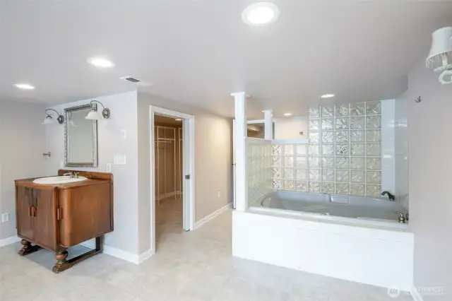 Basement full bathroom with walk-in closet