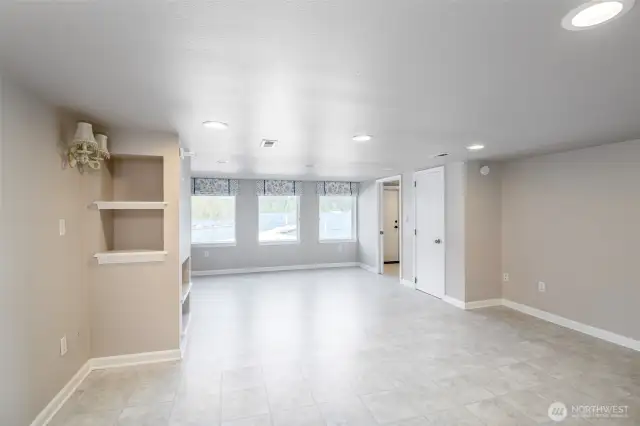 Basement living space with views of the lake and back yard