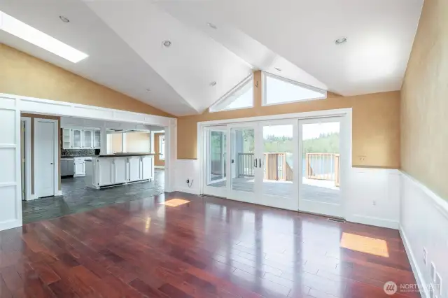 Beautiful architecture in the family room ceiling to focus the open view to the lake! Open concept and spacious living with doors from the family room and dining/nook to access the rear deck.