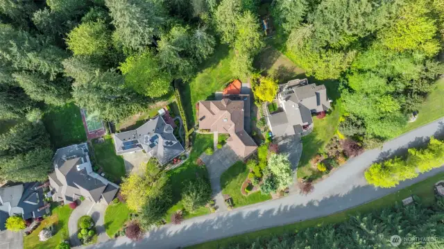 Private neighborhood with large lots backing land owned by the HOA. Second house from the right on the picture.