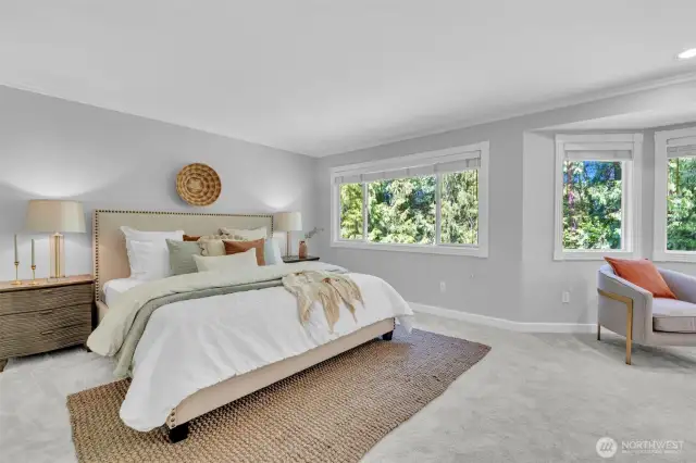 Primary Suite featuring new carpet and remodeled bathroom!