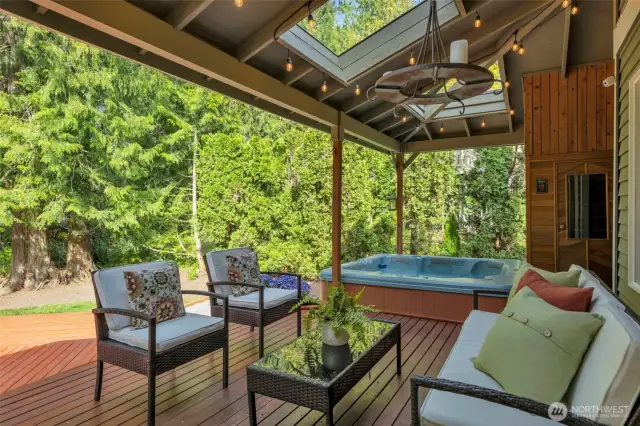 Part of the deck that is covered, with skylights to still get natural light. Sauna and Hot Tub to unwind after a busy day!