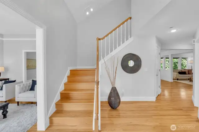 Spacious and welcoming entry with large coat closet under the staircase.