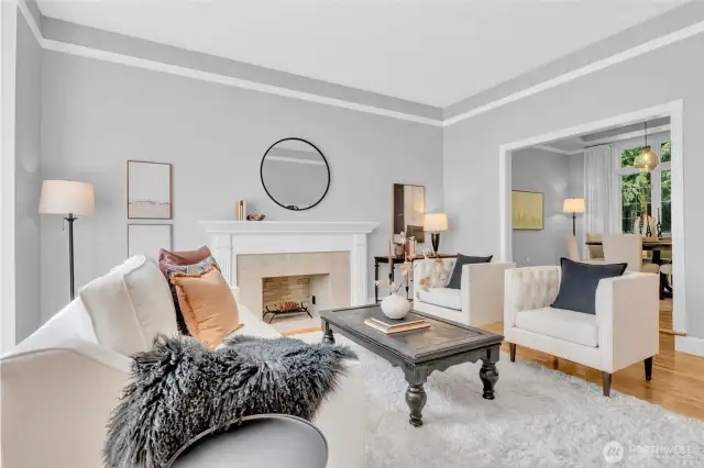 Formal Living Room with fireplace. Solid hardwood flooring.