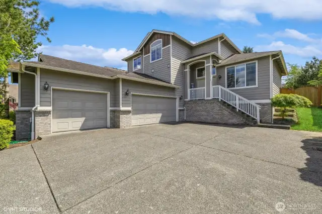 This beautiful home features a spacious 3-car garage, wide driveway.