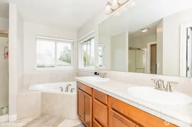 "Primary bath features a luxurious soaking tub and separate walk-in shower."