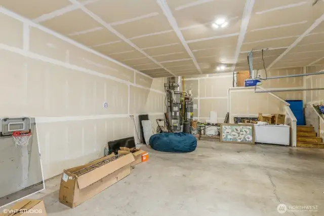 "3-car garage with plenty of room for vehicles, storage, or a home gym/workbench."
