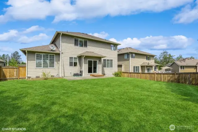 "Spacious backyard perfect for entertaining, relaxing, or play—fully fenced and private."
