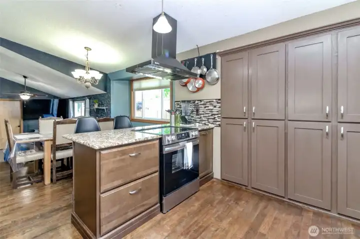 The pantry is built into the wall.  Notice the floors which as newer too! Owner has since removed appliances but if a loan needs it, may be able to bring back.