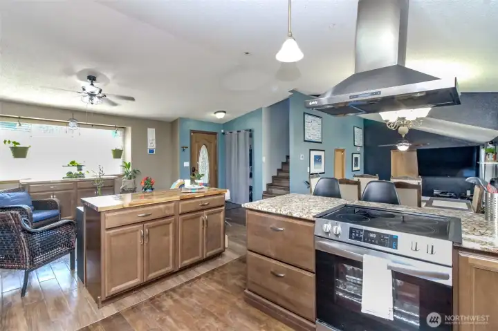 Kitchen was recently remodeled - a half wall was taken out to open the floor plan up and all these cabinets and counters are newer.  Owner removed oven but may replace if loan needs it.