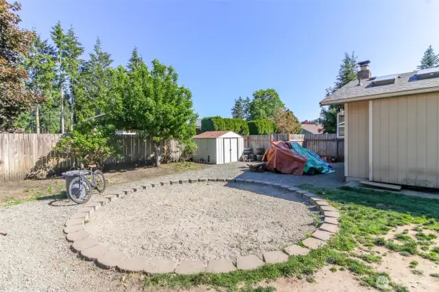 There used to be an above ground pool in this circular area which the pool equipment was housed in the white shed-the equipment was removed but there is still power there.