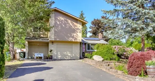 Two driveways for this large property, the second driveway is on the right unseen by the landscape