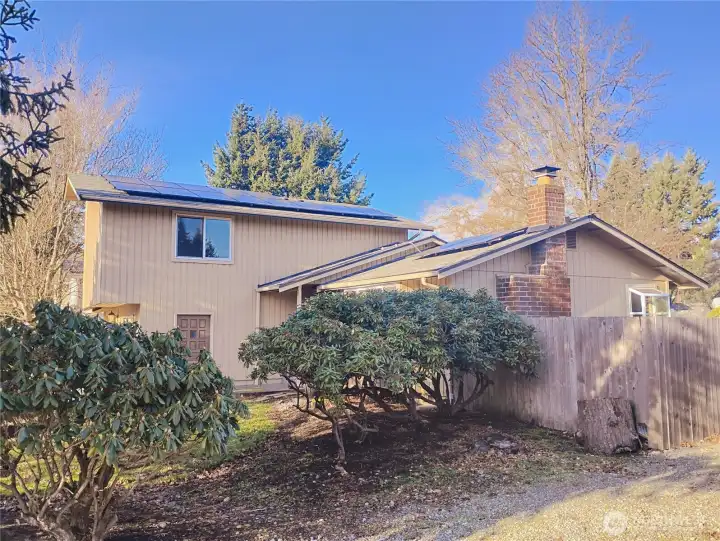 This is a photo of the side of the house during the winter of 2025.