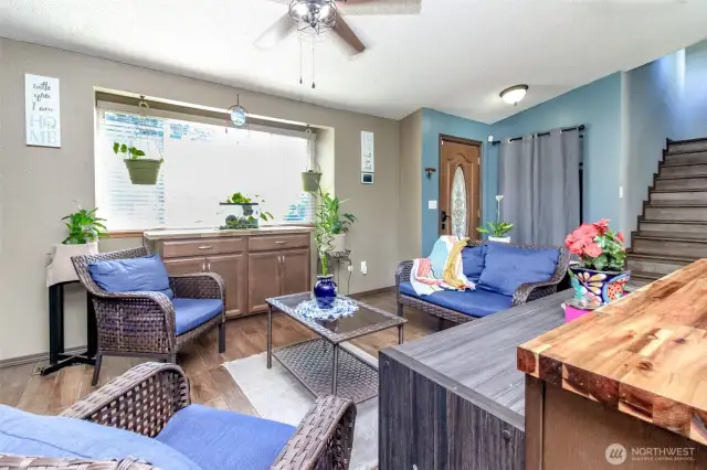 Once inside your front door, the living room with the high ceilings, opens up to the kitchen and dining room.  Notice the bay window here