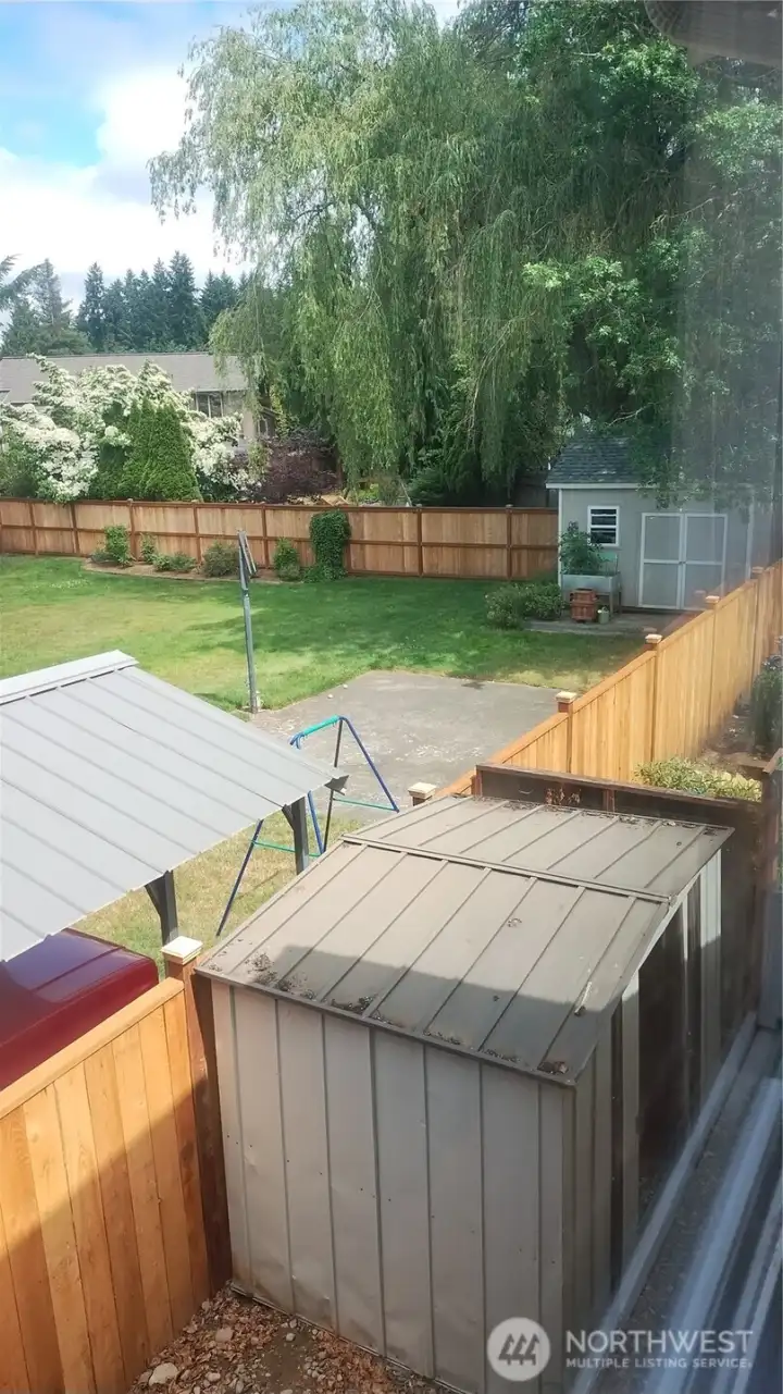 There is a second shed on the side of the house where the A.C. unit is.  The neighbor also has a very nice yard which you can see from the second floor bedroom.  This is a great neighborhood with good looking homes and yards!