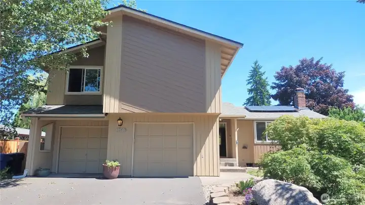 Two driveways for this large property, the second driveway is on the right unseen by the landscape