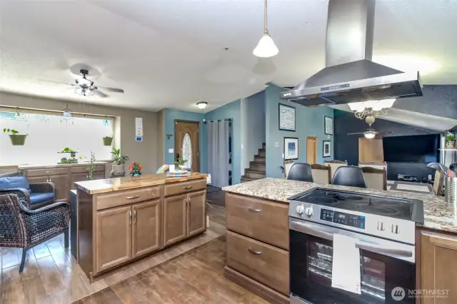Kitchen was recently remodeled - a half wall was taken out to open the floor plan up and all these cabinets and counters are newer plus the range/stove.