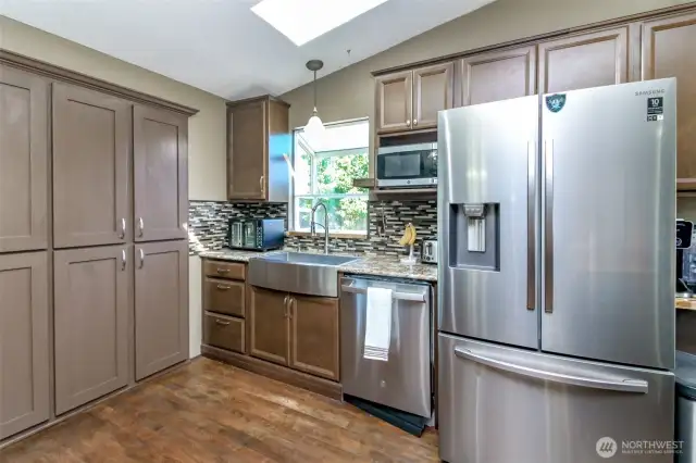 Kitchen appliances can stay.  Notice the drop in sink with garden window behind it.