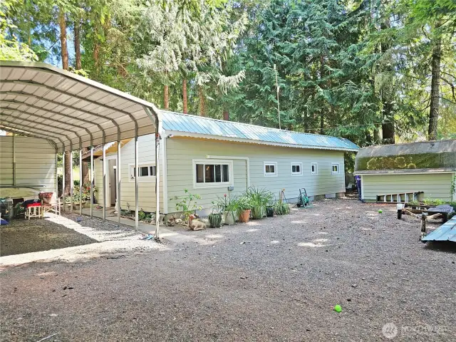 Taking a step back you can see the smaller of the two metal carports. The other one, shown it later pictures, can fit a large size motorhome and has power, water, and a septic dump.