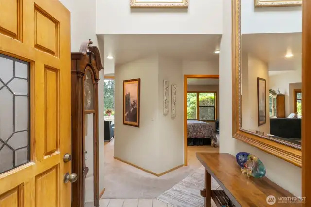 Entering the home.  Bedrooms to the right. Living, Dining, and Kitchen to the left.