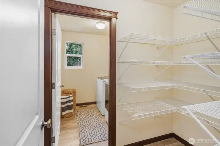 Pantry and laundry off kitchen.