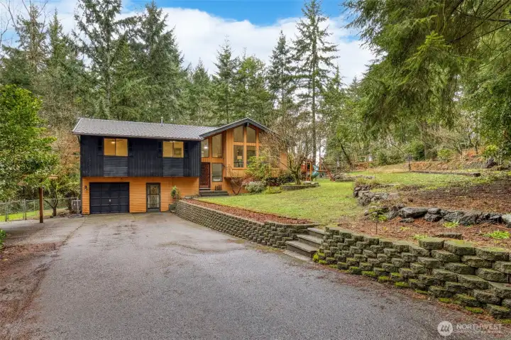 This home has plenty of parking! The garage, the covered carport, and driveway.