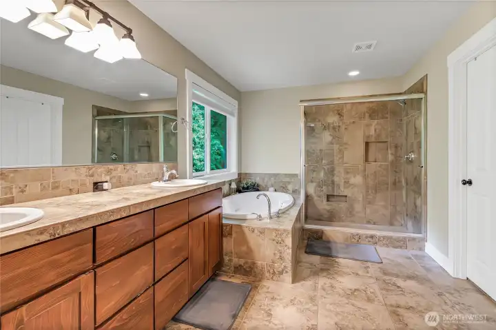Primary bathroom with large walk in closet.